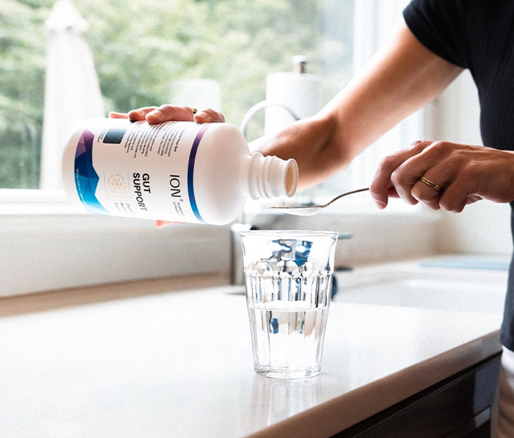Pouring ION* Gut Support 32oz